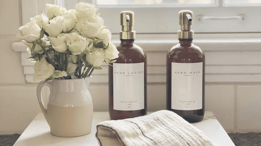 Neutral kitchen countertop styling with soap dispensers and decor