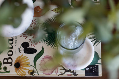 coaster on book with cup