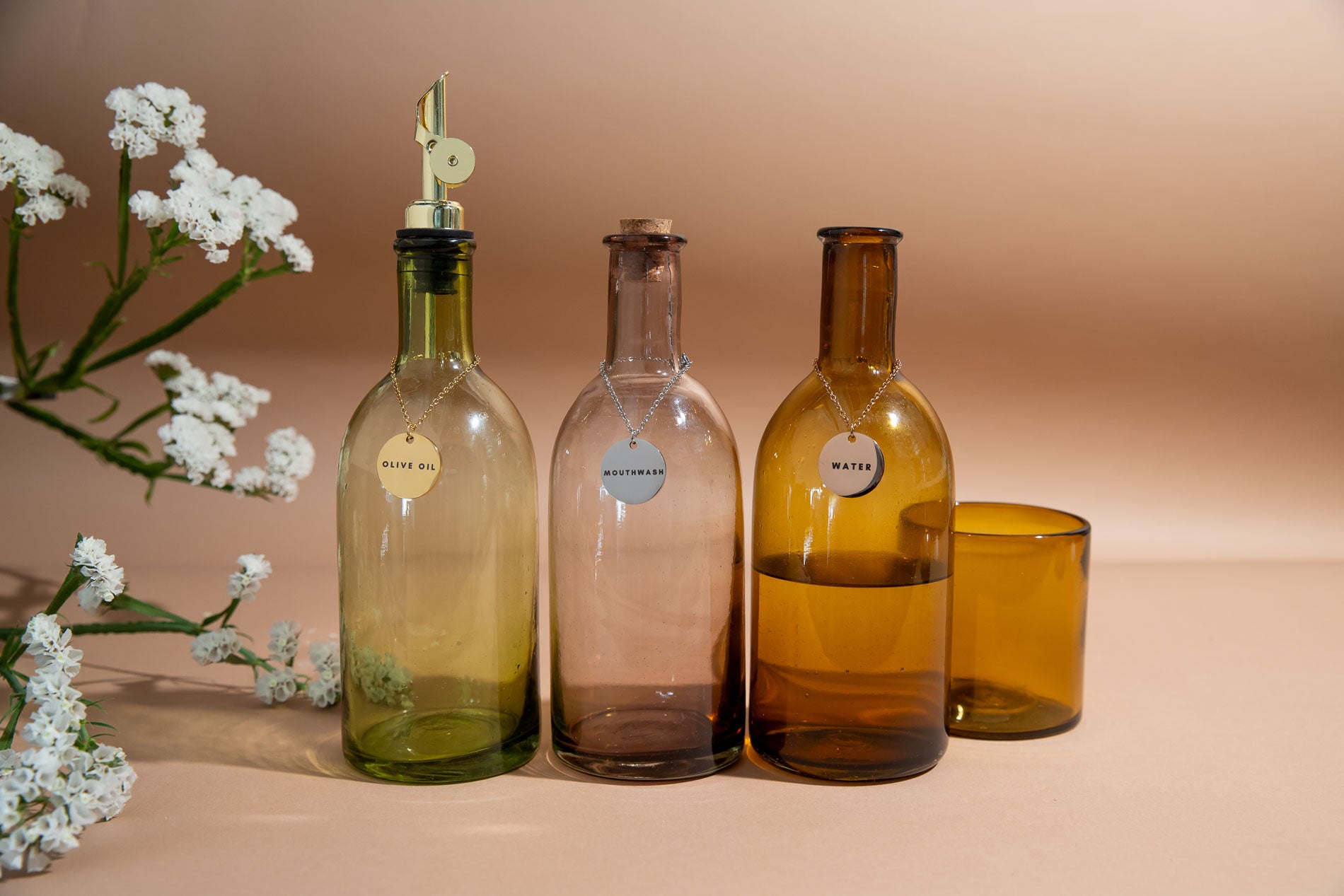 pourer with metal tag