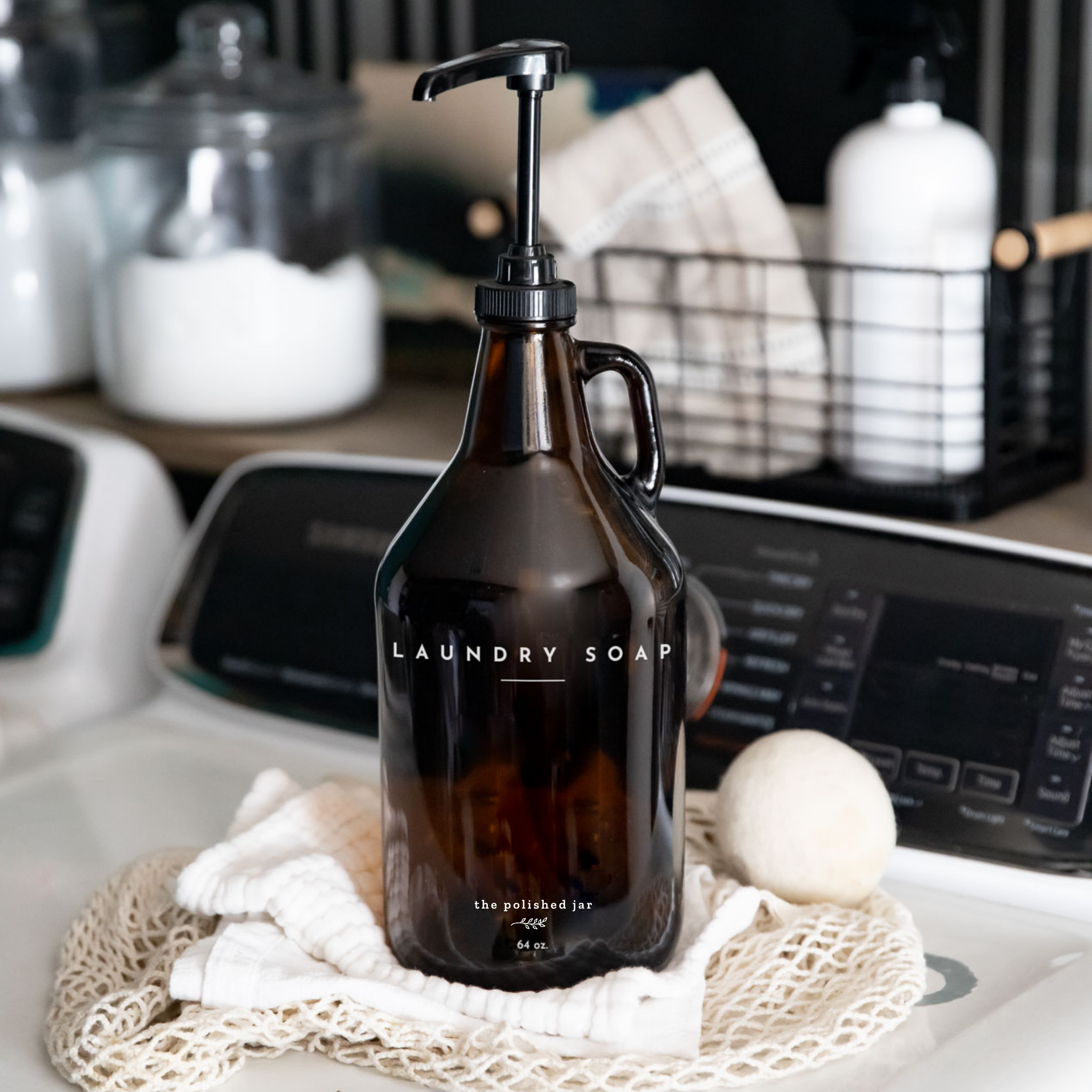 Brown laundry soap bottle with pump on a washing machine